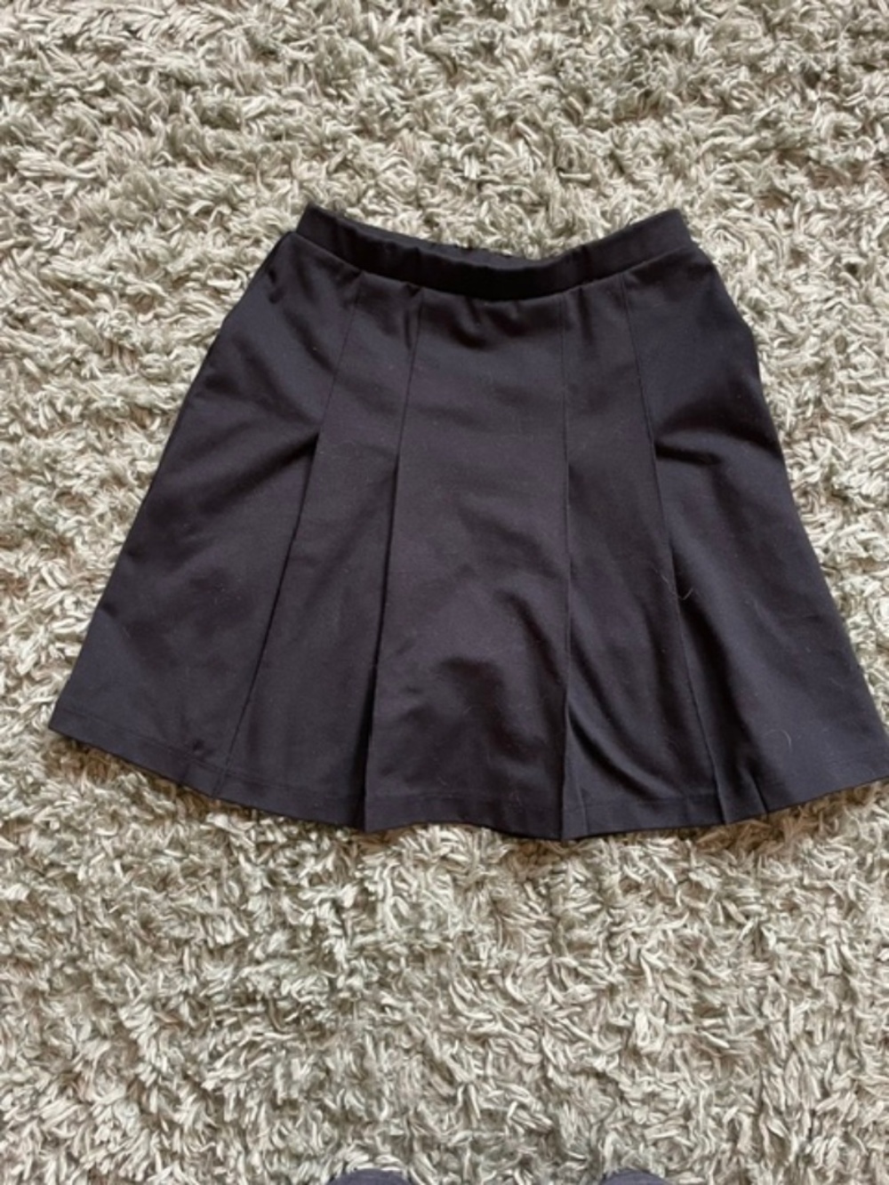 Girls black pleated skirt